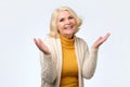 Old adult blonde excited cheerful astonished lady smiling, laughing Royalty Free Stock Photo