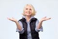 Old adult blonde excited cheerful astonished lady smiling, laughing Royalty Free Stock Photo