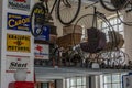 Old advertising signs and historical baby carriages