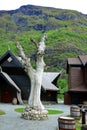 Old Aegir carving on a tree trunk in Flam Norway Royalty Free Stock Photo