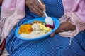 African woman having lunch