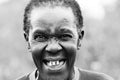 A old African woman smiles with a toothless grin Royalty Free Stock Photo