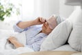 senior woman with eye sleeping mask in bed at home Royalty Free Stock Photo