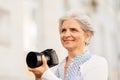 Senior woman photographing by digital camera Royalty Free Stock Photo