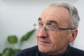 old age, problem and people concept - close up of senior man in glasses thinking. Royalty Free Stock Photo