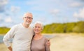 Happy senior couple hugging over beach background Royalty Free Stock Photo