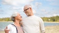 Happy senior couple hugging over beach background Royalty Free Stock Photo