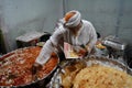 Old age Shopkeeper Selling very famous halwa and paratha at Zakaria Street