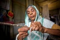An old age woman is making fiber rope at Madhupur, Tangail, Bangladesh