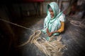 An old age woman is making fiber rope at Madhupur, Tangail, Bangladesh