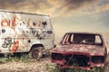 Old, aged, abondened, rotten and rusty vehicles stay in a automobile dumpster in a desert. Recycling concept in junk