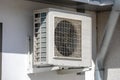 Old aged air conditioner machine outside mounted at wall with dirty ventilator of cooler device Royalty Free Stock Photo