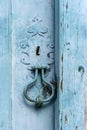 Old and aged blue historic church wooden door knob Royalty Free Stock Photo