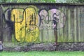 Old and aged color graffiti drawing on the wall. Royalty Free Stock Photo