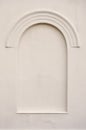 Old aged plastered faux arch false fake window stucco frame background, blank empty vertical copy space, light tan beige sepia