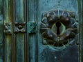 Old aged green and bronze color door lock detail with keyhole