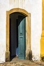 Old and aged historic church door in blue-green wood in the city of Ouro Preto Royalty Free Stock Photo