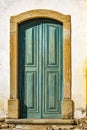 Old and aged historic church door in blue-green wood Royalty Free Stock Photo