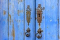 Old and aged historic church door in blue wood Royalty Free Stock Photo