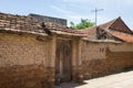 Old aged house entrance and wall made of laterite in Duong Lam ancient village, Son Tay district, Hanoi, Vietnam