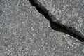 Old aged weathered cracked grey black tarmac texture pattern, large detailed damaged textured asphalt grungy background flat lay Royalty Free Stock Photo