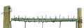 Old aged weathered green painted metallic vintage fence gate large detailed upward driven security nails closeup panorama isolated