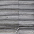 Old weathered natural grey damaged wooden farm shack wall, rustic grungy vertical background closeup, broken boarding pattern Royalty Free Stock Photo