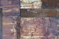 Old aged weathered rusty corroded coat iron sheets texture pattern, multiple horizontal rusted corroding grunge metal patch plates Royalty Free Stock Photo