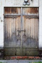 Old aged wooden door with white brick wall in Novodevichy Convent, Moscow city