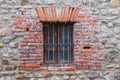 Old and aged wooden window with a metal fence Royalty Free Stock Photo