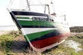 Old aground Fisher boat