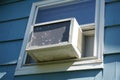 Old air conditioner installed on window Royalty Free Stock Photo