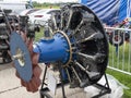 Old aircraft engine with wood propeller, vintage plane close up