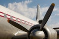 Old aircraft propeller and airframe with blue sky background Royalty Free Stock Photo