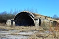 An old airfield with abandoned aircraft hangar military landscape Royalty Free Stock Photo