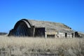 An old airfield with abandoned aircraft hangar military landscape Royalty Free Stock Photo