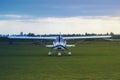 old airplane on a field ready to take off