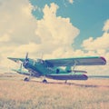 Old airplane on green grass Royalty Free Stock Photo