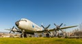 Old airplane on green meadow in sunlight Royalty Free Stock Photo