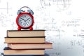 Old alarm clock and stack of books Royalty Free Stock Photo