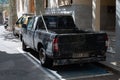 Old all-terrain first generation black Nissan Navara car parked on the street in Soller, Spain