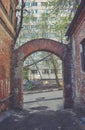 Old alley with arch from red brick Royalty Free Stock Photo