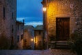 Old alley with brick buildings at twilight