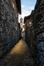 Old alley in an Italian village of Lake Como at sunset Royalty Free Stock Photo