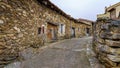 Old alley of small stone houses in a state of ruin by the passage of time