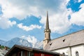 Old alpine church in picturesque mountain town.