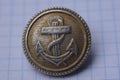 Old aluminum german military button with sea anchor