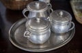 Old aluminum sugar bowls on a tray Royalty Free Stock Photo
