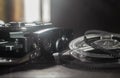 Old amateur movie camera and reels of film stock