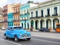 Old american car near colorful buildings in Havana Royalty Free Stock Photo